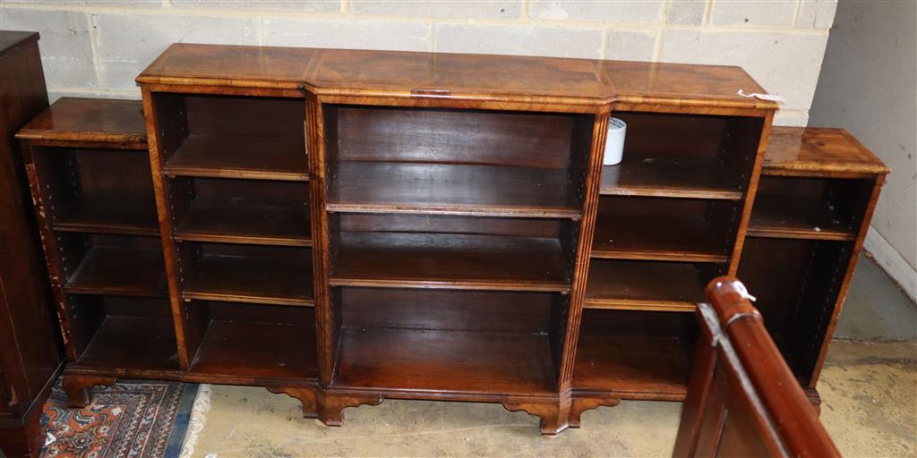 A Queen Anne style burr walnut breakfront open bookcase, width 216cm, depth 31cm, height 105cm